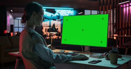 Over the Shoulder: Female Caucasian Specialist Working on Computer with Chroma Key Display at...