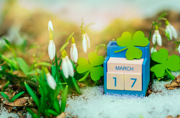 Save the date white block calendar for St Patrick's Day, March 17 on green background.