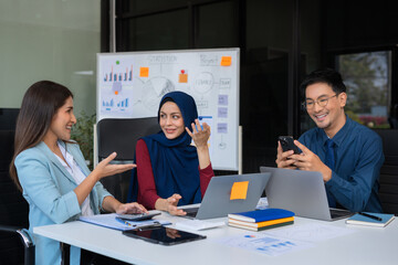 Business corporate team brainstorming, planning strategy having a discussion Analysis investment researching with chart at office desk documents in office.