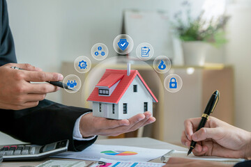 Man insurance agent holding house model with home insurance icon. Property insurance security...