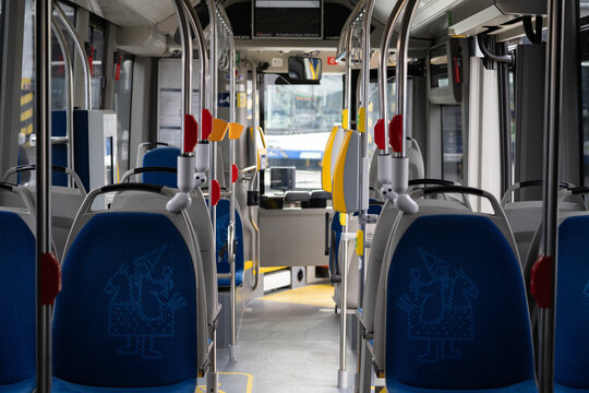 Inside view of passenger bus cabin with seats. Onboard autobus coach in service for MPK Krak&oacute;w Public Transport in Cracow. Empty interior of city mass transit bus on March 2, 2024 in Krakow, Poland.