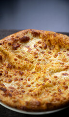 Megrelian cheese khachapuri served on a plate in a Georgian restaurant