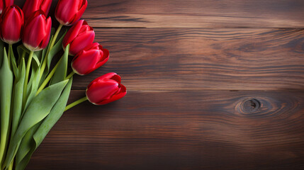 Naklejka na ściany i meble Red tulips on a wooden background