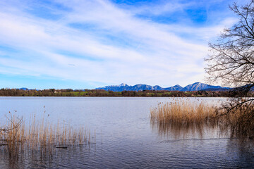 View over the Staffelsee in Bavaria from Uffing to the opposite shore and the Kochel mountains in the Alps