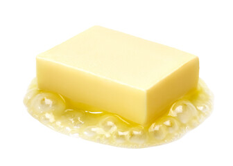 A piece of melting butter isolated