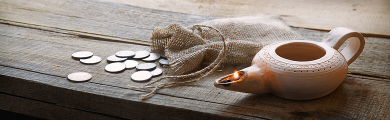 Pouch with silver coins on a wooden table