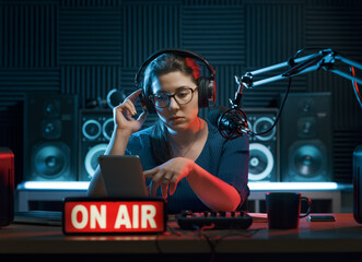 DJ using a digital tablet during a radio show