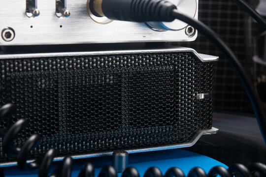 close-up of music system amplifier mesh and wires