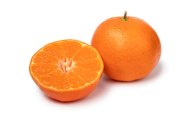 Whole and halved fresh ripe healthy Leanri mandarins isolated on white background close up