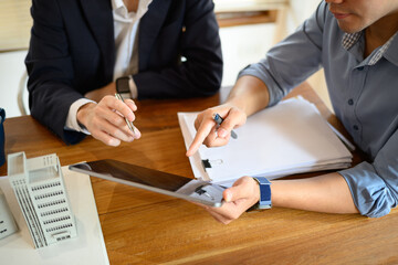 Cropped shot of investors using digital tablet and planning for new construction project at office