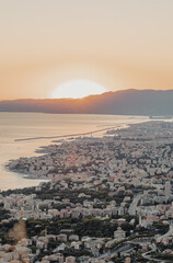 Panoramic Sunset overlooking Genoa, Italy. Coastal City, Harbour and bay area