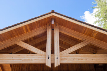New wooden truss structure called palladian truss with beams and wooden roof - obrazy, fototapety, plakaty