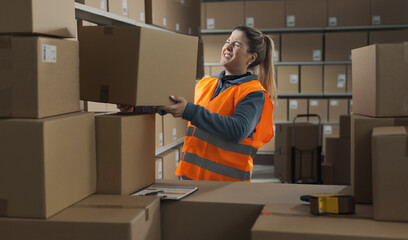 Warehouse worker lifting a heavy box