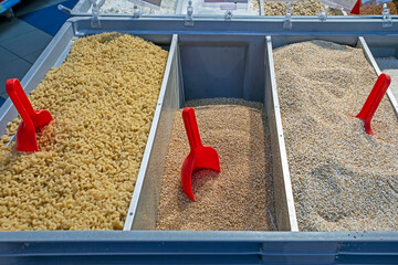 bulk cereals and pasta, pasta, buckwheat, oatmeal in containers by weight in the supermarket....