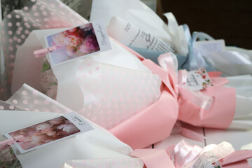 Wedding bouquets in pink and white wrapping paper. Selective focus. Close-up