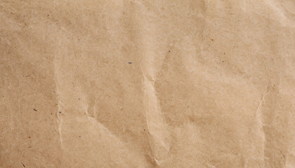 Soft brown recycled paper with a crumpled texture, suitable for eco-friendly project backgrounds.