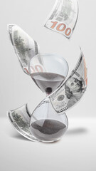Close up hourglass and money isolated over white background.