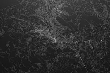 Street map of Tbilisi (Georgia) on black paper with light coming from top