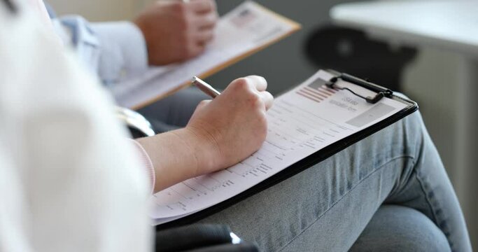 People fill out American visa application form by filling out paperwork. USA law study concept. American border or visa agreement concept