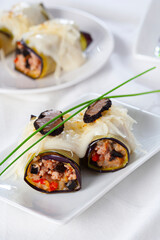 Eggplant cannelloni stuffed with meat and black truffle..