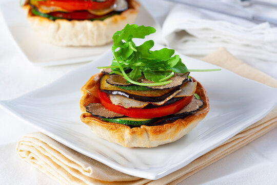 Grilled vegetable tartlet with arugula and black truffle...