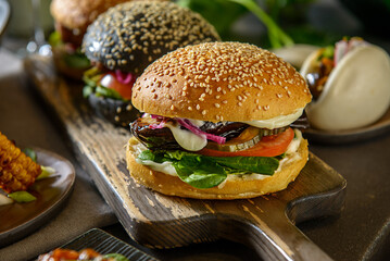 Set of 2 Vegan Vegetarian Burger plant based, on a cutting board. Side view.