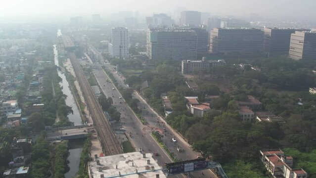 Aerial foggy shot of chennai commercial area with corporate buildings sunrise