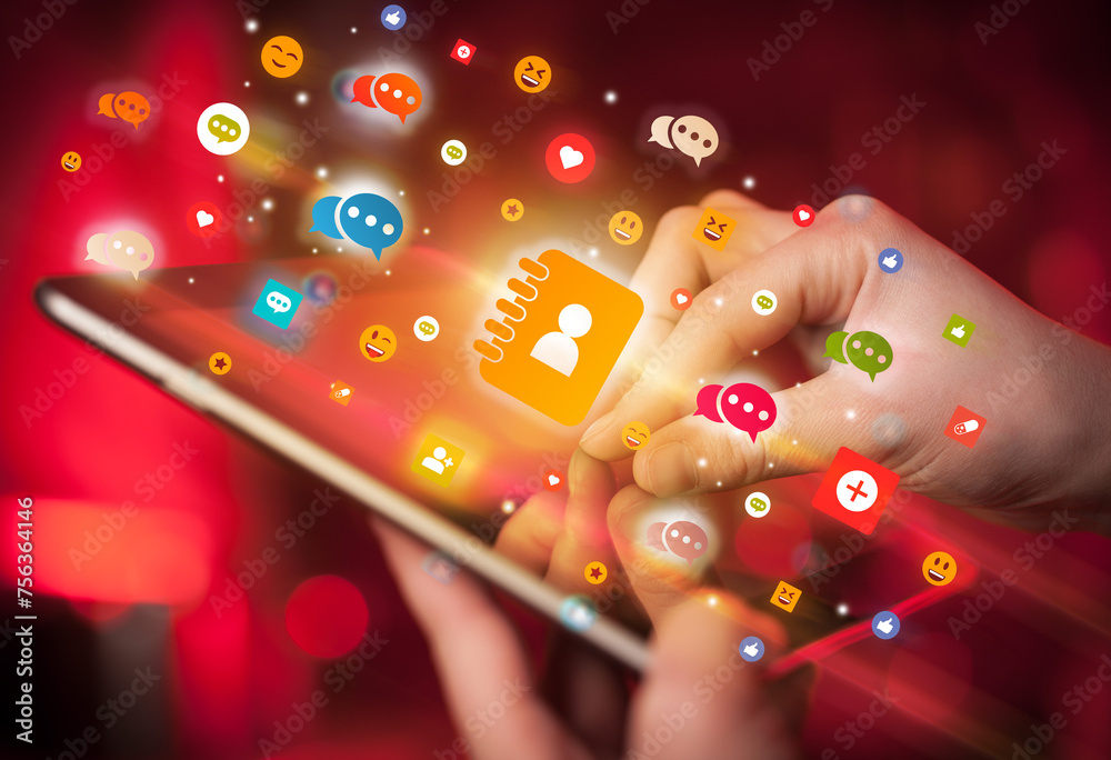 Aufkleber close-up of a hand using tablet with social media icons