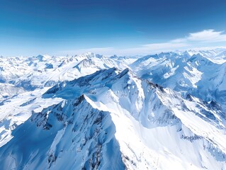 Aerial panorama of the snow-kissed Alps under clear blue skies, an explorer's snowy paradise.