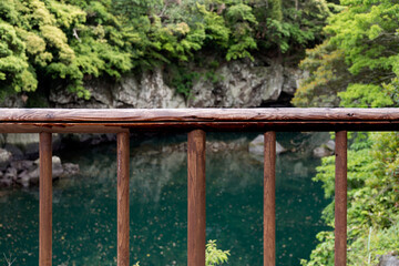Fototapeta premium The wooden fence at the lakeside