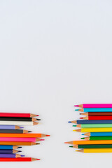 Colorful pencils isolated on white background, back to school, Chipped colored crayons on white background, close up. Colour pencils made craft on the wooden board 