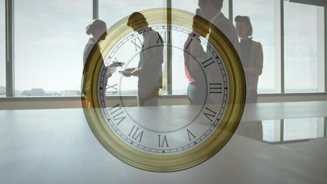 Animation of moving clock over diverse colleagues discussing work in office