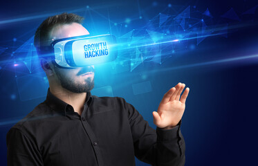 Obraz premium Businessman looking through Virtual Reality glasses, virtual security concept