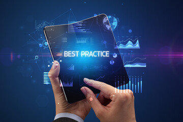 Businessman holding a foldable smartphone, business concept