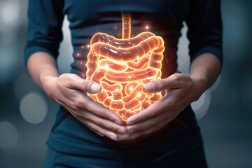 A woman is holding a stomach with glowing organs