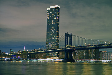 Manhattan Bridge, suspension bridge that crosses East River in New York City, connecting Lower Manhattan with Downtown Brooklyn. Evening