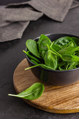Fresh green spinach leaves in the bowl. Natural vegetarian food.