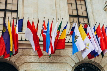 National flags of various countries flying in the wind. Colorful flags from different countries. Flags Organization for Security and Co-operation in Europe