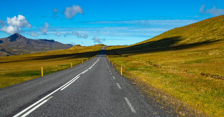 Panoramic landscape with lonely country road on south coast of Iceland. Deserted area in pristine...