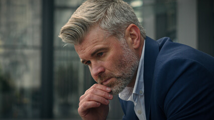 Pensive sad worried sorrowful thoughtful middle-aged man senior mature business employer...