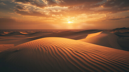 Sunset over sand dunes in the desert, with amazing cloudscape