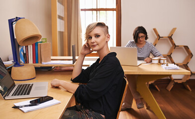 Portrait, businesswoman and coworking in home office with confidence, laptop and technology for...