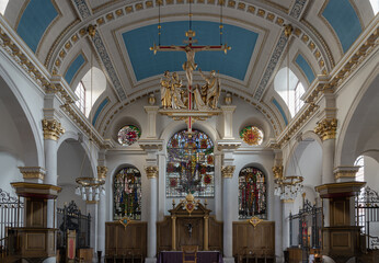 Fototapeta na wymiar Interior view St Mary le Bow Church and The modern hanging sculptural of Crucifixion in church St.Mary le Bow (Sir Christopher Wren). Space for text, Selective focus.