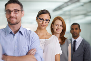 Fototapeta premium Portrait, team and confident business woman in office or workplace with arms crossed. Face, diversity and group of people in row for cooperation, collaboration and advisors with glasses together