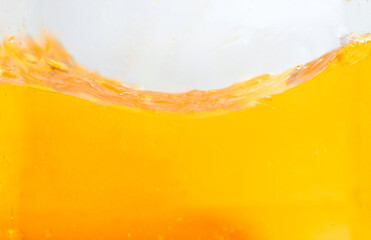 Orange juice splashes on a white background for Fresh healthy and drinks