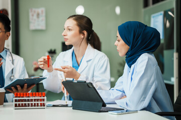 A diverse group of healthcare professionals, including doctors, nurses, and specialists, engaging in a collaborative meeting to discuss medical cases and share expertise in a hospital