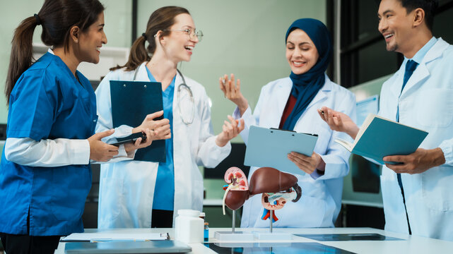 A diverse group of healthcare professionals, including doctors, nurses, and specialists, engaging in a collaborative meeting to discuss medical cases and share expertise in a hospital