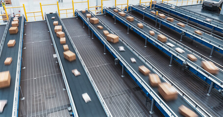 Establishing Shot: Modern Delivery Logistics Station Warehouse with Working Automated Conveyor Belt...