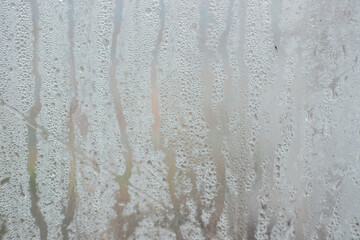 Rainwater drops on a transparent background made of waterproof fabric. Texture and abstract background.
