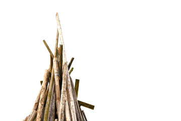 Many wood sticks piled together as tepee construction on white background
